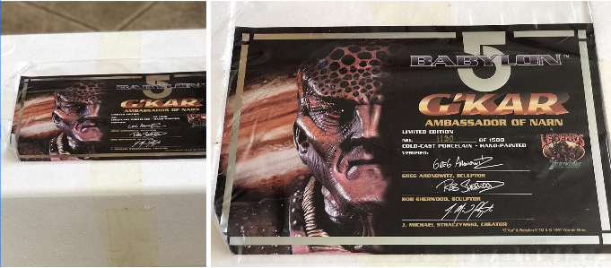 Two business cards featuring a character from 'Babylon 5' on a white surface.