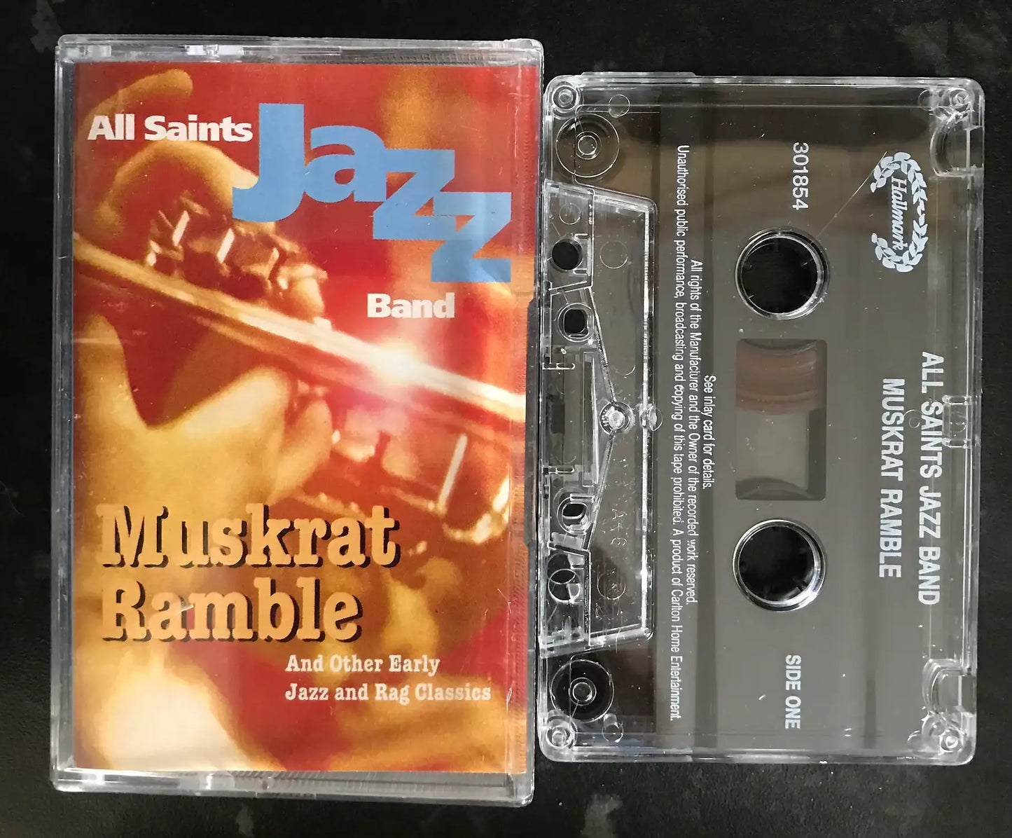 Vintage All Saints Jazz Band "Muskrat Ramble" cassette tape with clear case and red/gold cover art.