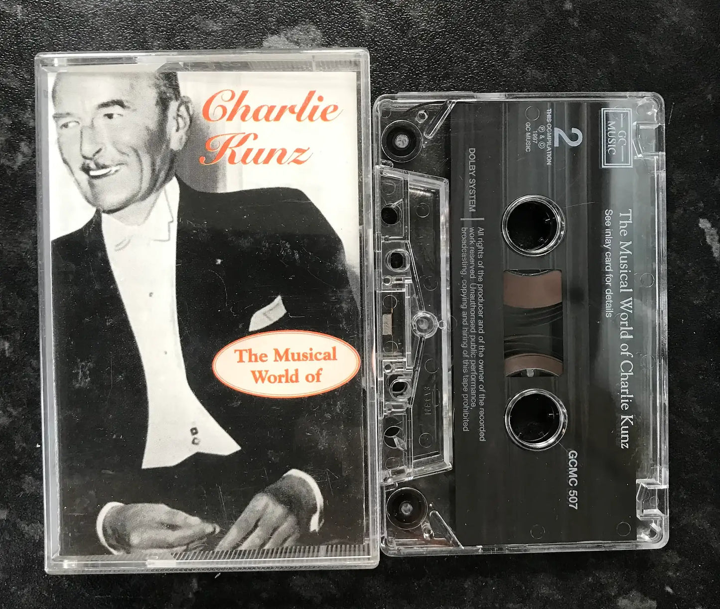 Vintage Charlie Kunz "The Musical World Of" cassette tape with clear case and black tape.