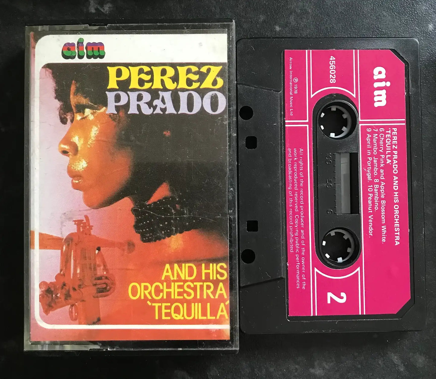 Vintage Perez Prado "Tequila" cassette tape with a colorful album cover and black tape with pink label.