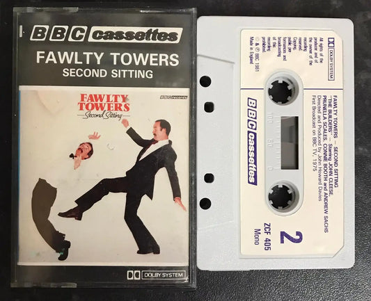Vintage BBC Cassettes Fawlty Towers Second Sitting audiobook, with cover art showing John Cleese kicking a man.