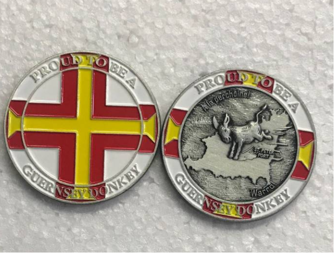Two coins with different designs on a textured surface