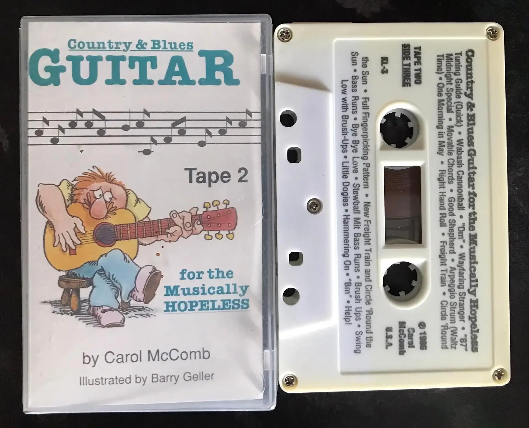 White "Country & Blues Guitar for the Musically Hopeless, Tape 2" cassette with clear case and cartoon cover.