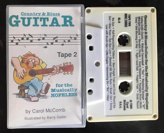 White "Country & Blues Guitar for the Musically Hopeless, Tape 2" cassette with clear case and cartoon cover.