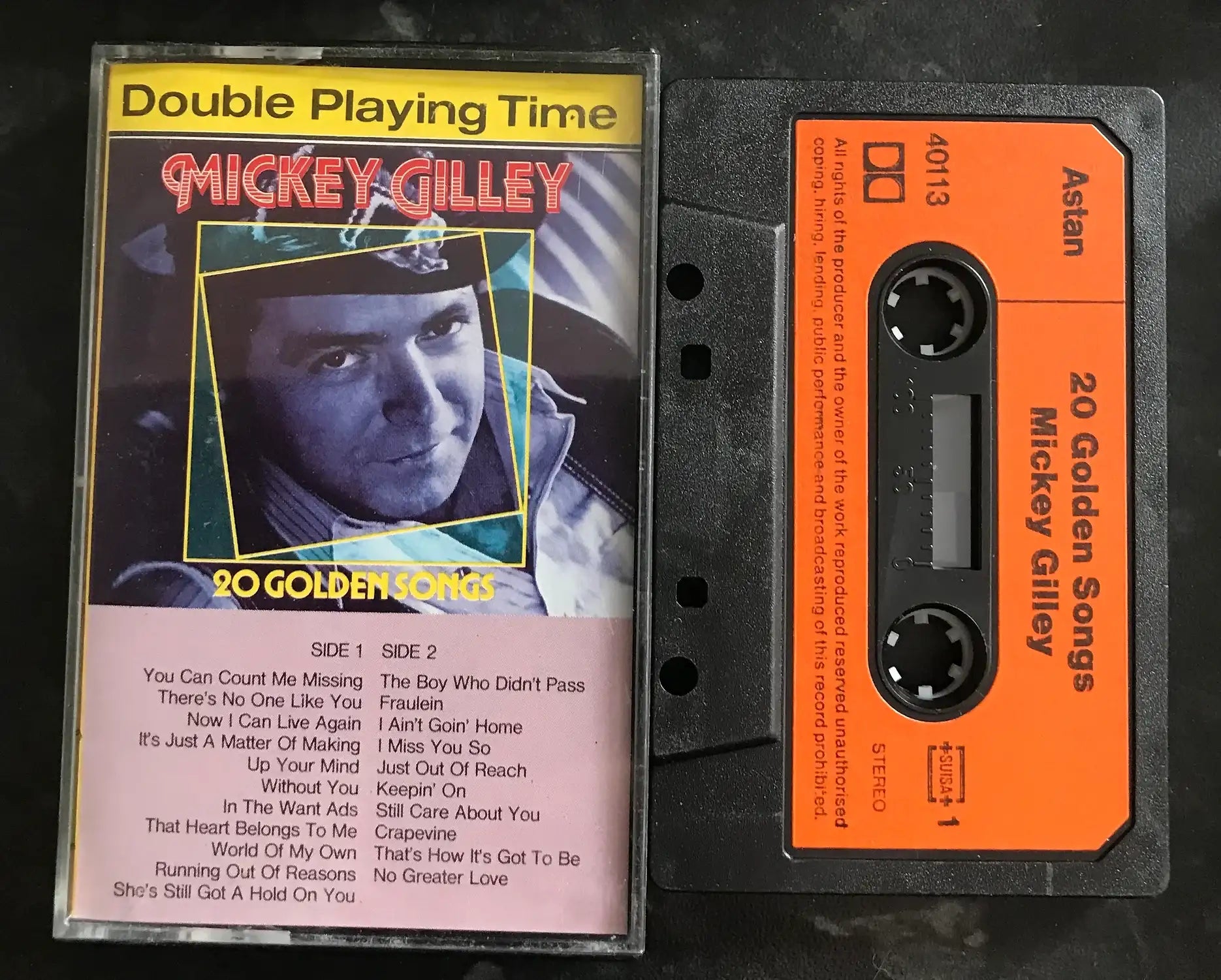 Vintage Mickey Gilley "20 Golden Songs" cassette with colorful inlay and orange tape.