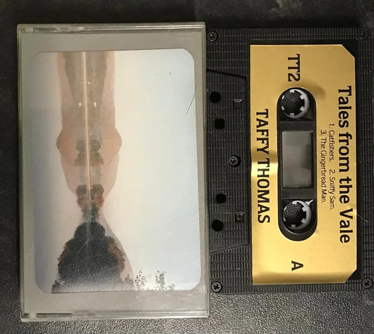 Vintage Taffy Thomas "Tales from the Vale" TT2 black cassette with gold label and clear plastic case.